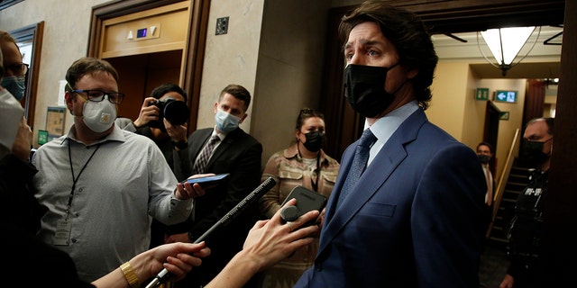 Justin Trudeau, Prime Minister of Canada, speaks to members of the media in the lobby of the House of Commons in Ottawa, Ontario, Canada, Thursday, February 10, 2022. Canadian police threatened Wednesday to begin arresting truck drivers and other protesters who have closed downtown Ottawa for two weeks in protest on Covid-19 restrictions, AFP reports.