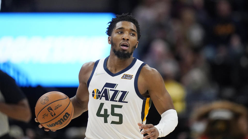 Donovan Mitchell, the 45-year-old Utah Jazz guard, brings the ball onto the field in the second inning during an NBA basketball game against the Houston Rockets on Monday, February 14, 2022, in Salt Lake City.  (AP Photo/Rick Bowmer)