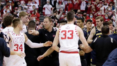 Wisconsin Badgers assistant coach Joe Krabenhoft reacts after a fight broke out between Wisconsin and Michigan.