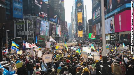 Anti-war protesters gather in Times Square in New York, on February 26, 2022, to protest against Russian attacks on Ukraine. 