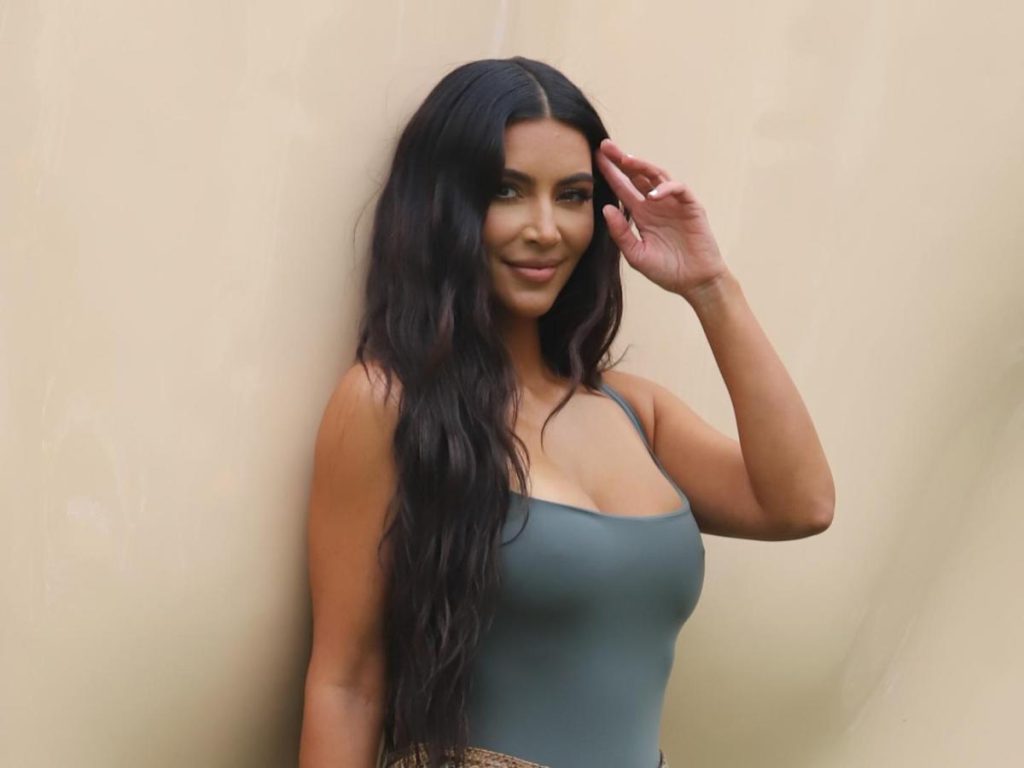 Kim Kardashian walks the wild side in a flared bikini and motorcycle shots