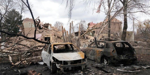 Smashed cars after a nighttime air strike on the village of Bushev, 40 kilometers west of Kyiv, Ukraine, Friday, March 4, 2022.