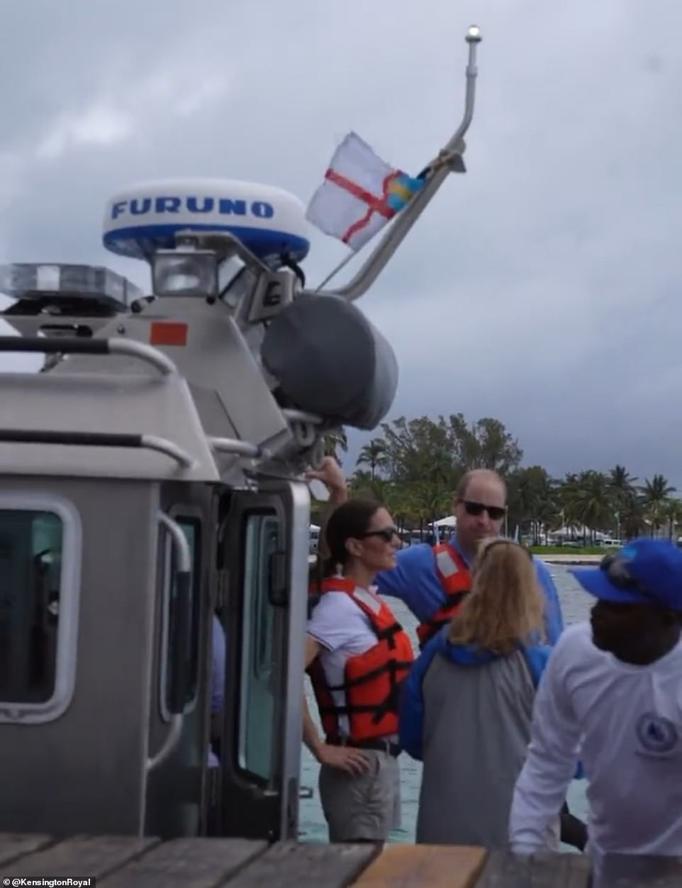 Safety first: The Duke and Duchess of Cambridge wear life jackets during the Regatta in the Bahamas yesterday afternoon