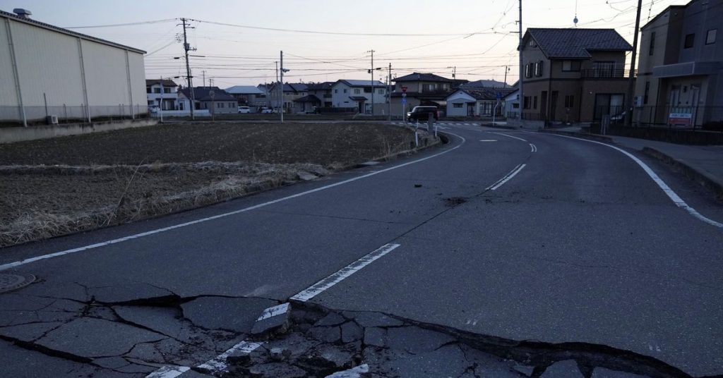 An earthquake in Japan killed two, shut down factories and cut power to thousands of homes