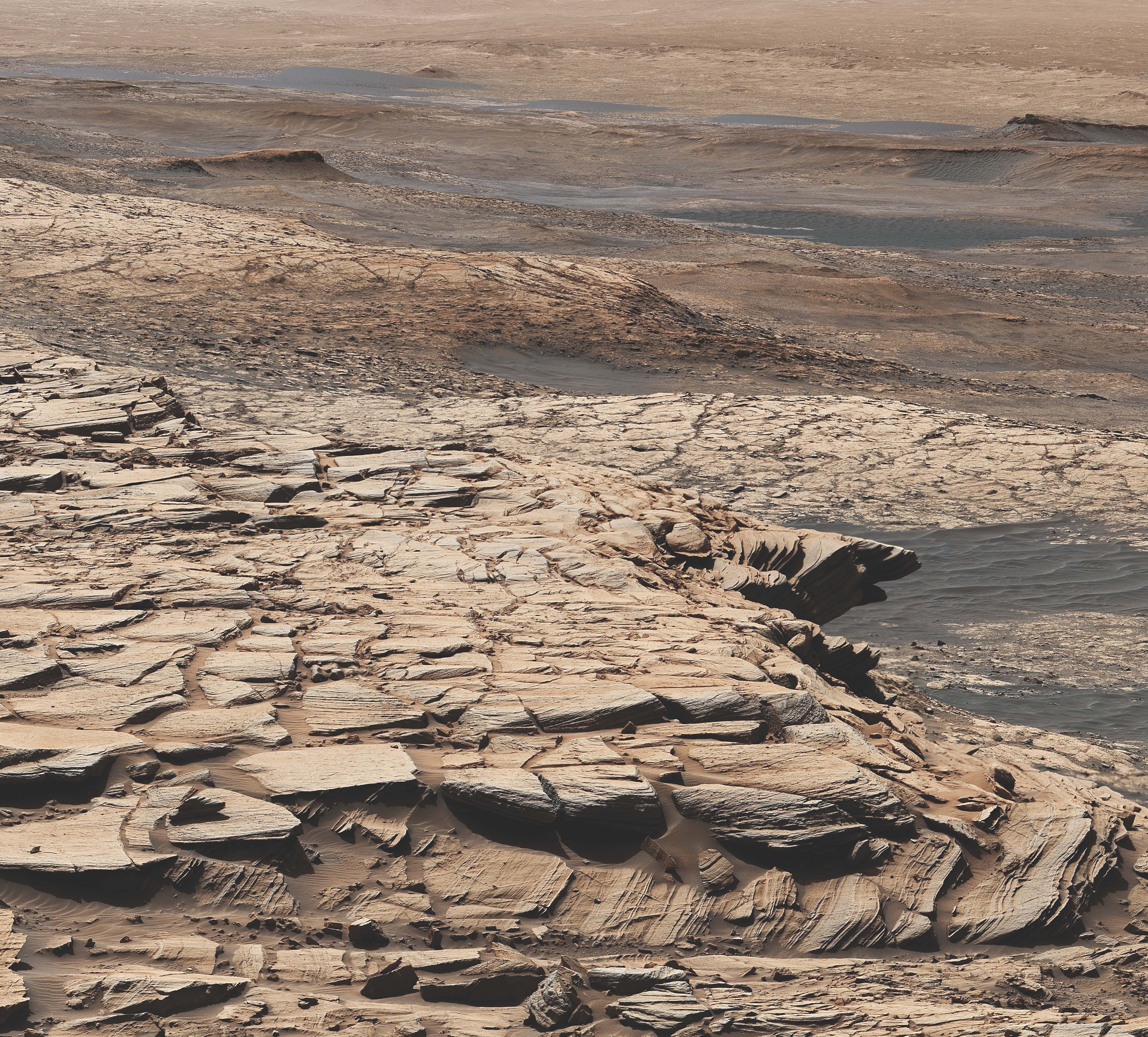 This mosaic was made from images taken by the MAST camera aboard NASA's Curiosity spacecraft on Mars Day 2729, or the first day of the mission.  Landscape shows the Stimson sandstone formation in Gale Crater.  At this general site, Curiosity drilled the Edinburgh drill hole, a sample of which was enriched with carbon 12.