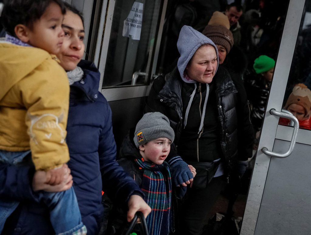 People board an evacuation train from Kyiv to Lviv, at Kyiv central train station, on March 6.