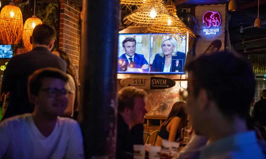 The debate is shown on a screen in a bar in Paris