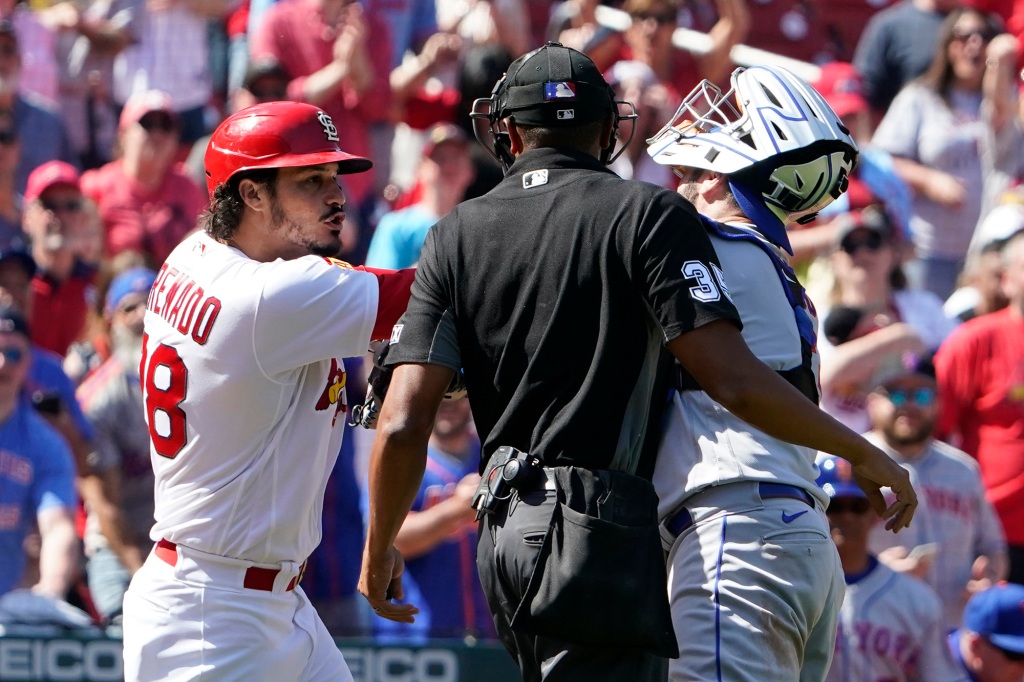 Nolan Arenado (left) quarrels with Thomas Nido as a brawl erupted between the Mets and the Cardinals on Thursday.