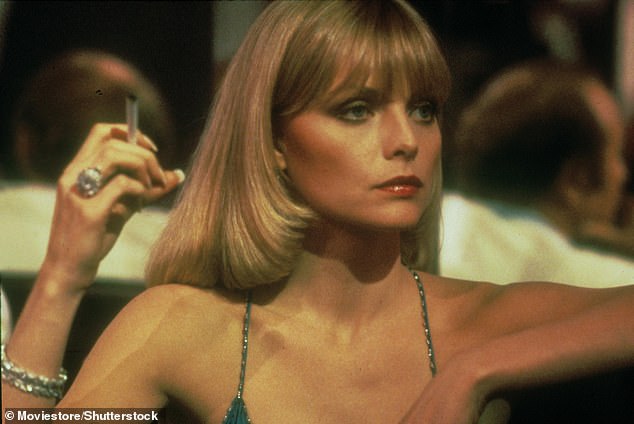 Megastar: Michelle — who has appeared in films like Scarface (pictured here), Grease 2, The Witches of Eastwick and Batman Returns has said she's taking a break from Hollywood for her kids