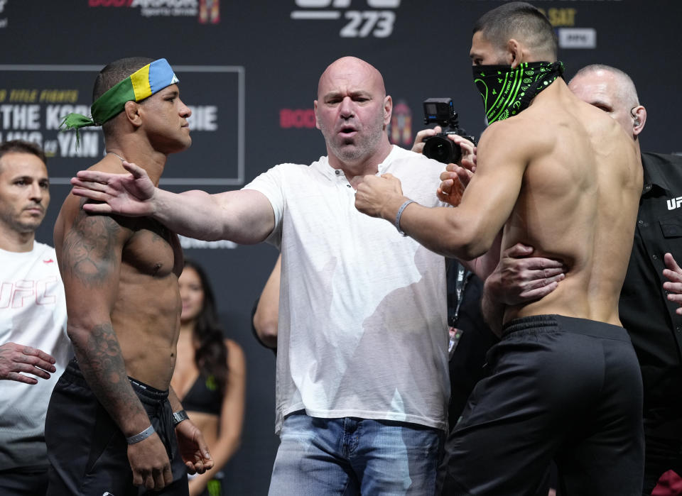 JACKSONVILLE, FL - APRIL 8: (From left to right) antagonists Gilbert Burns of Brazil and Khamees Shemayev of Russia face off during the ceremonial UFC 273 weight ceremony at the VyStar Veterans Memorial Arena on April 8, 2022 in Jacksonville, Florida.  (Photo by Jeff Butare/Zuffa LLC)
