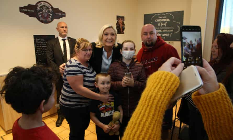 Marine Le Pen poses for a photo at a truck stop restaurant in Ruwi