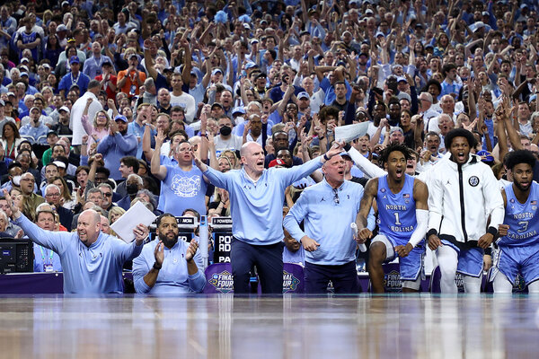 North Carolina players and coaches react on the sideline in the second half.