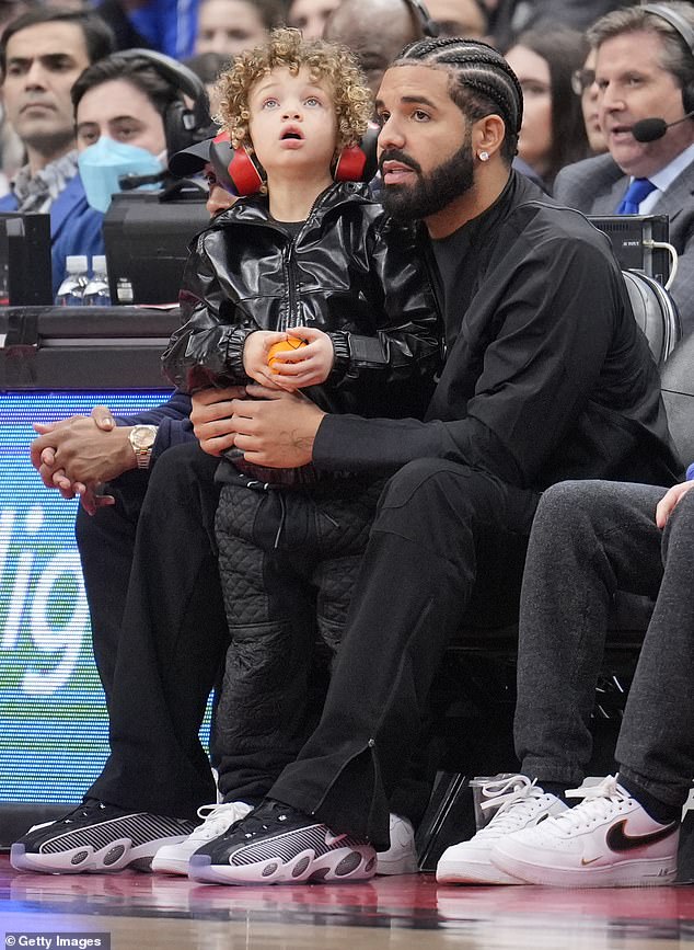 Family first: Drake sent a direct message to the wife of a social media troll after he insulted rapper Adonis's four-year-old son, as father and son were seen at an NBA game in Toronto last month
