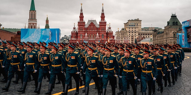 Russian soldiers march along Red Square during the Victory Day military parade in Moscow, May 9, 2021 (Photo by Dimitar Delkov/AFP) (Photo by Dimitar Delkov/AFP via Getty Images)