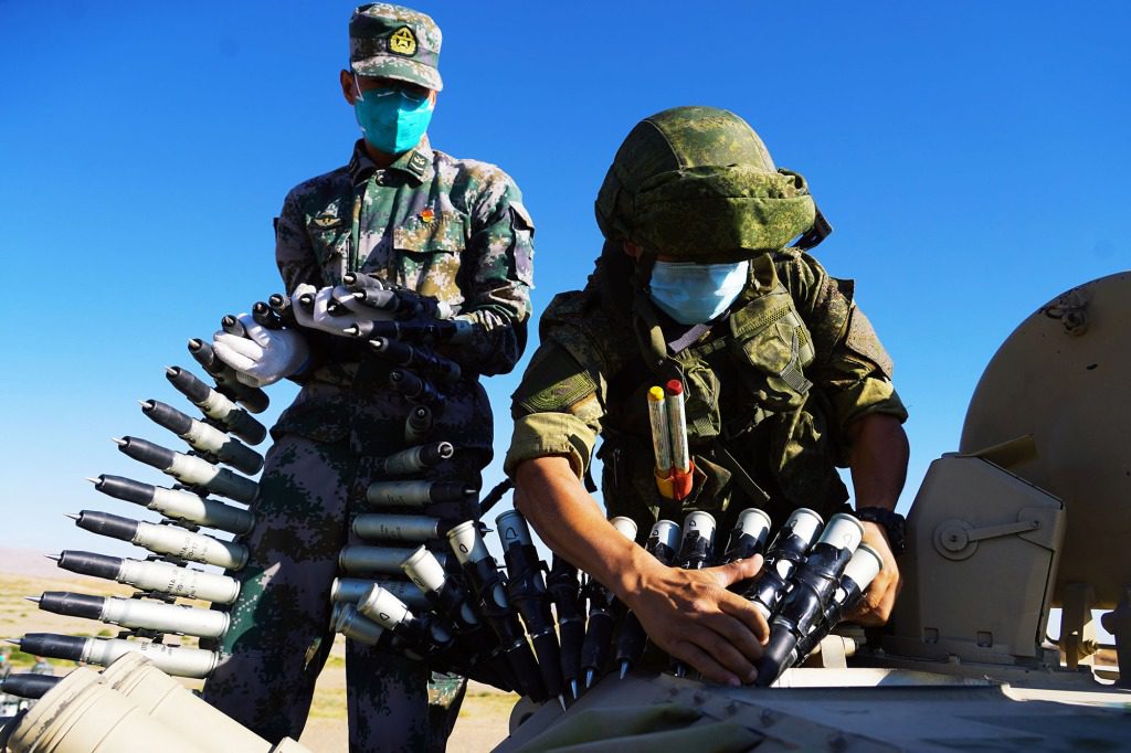 Military personnel prepare equipment for a joint military exercise between the Chinese and Russian armies.