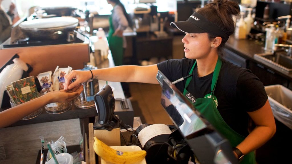 Starbucks raises wages, doubles worker training amid union pressure