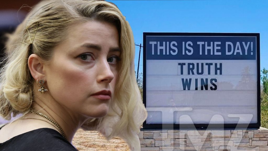 Read the "Truth Wins" sign on the road to Amber Heard's Home City
