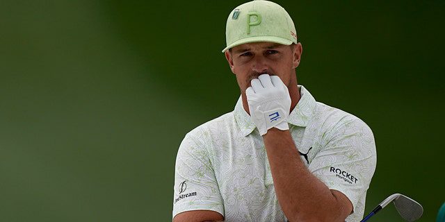 Bryson DeChambeau waits to take his shot into the seventh bunker during the second round at the Masters golf tournament on Friday, April 8, 2022, in Augusta, Ga.