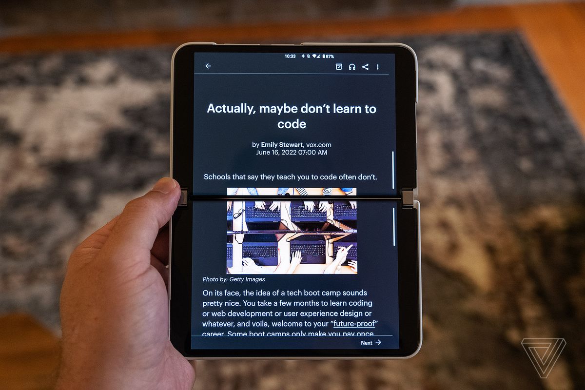 The Pocket Android app displays an article on both screens of the Surface Duo 2 while keeping it in portrait orientation.