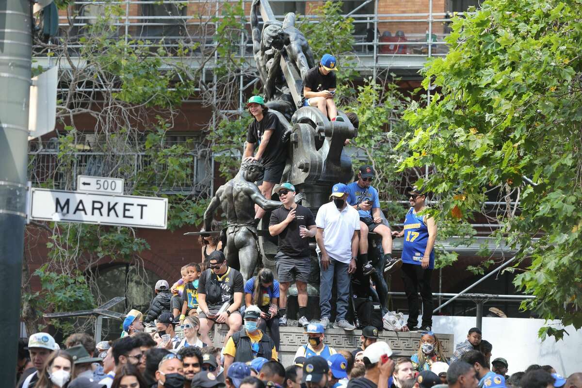Golden State Warriors fans line up along Market Street ahead of the team's victory parade on June 20, 2022 in San Francisco.
