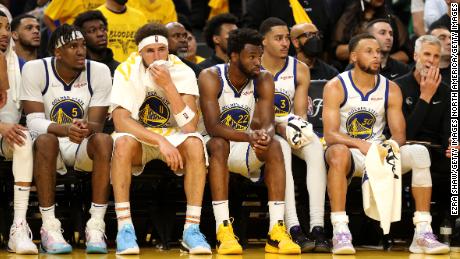 Warriors players look from the bench in the fourth quarter against the Celtics. 