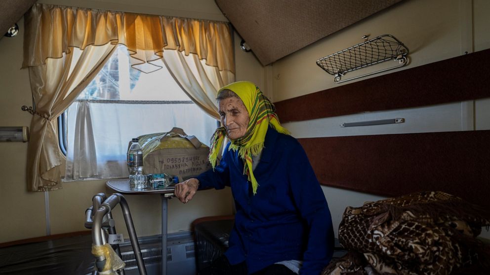 An elderly woman who has been evacuated from the Lysychansk area sit in an evacuation train in Pokrovsk in eastern Ukraine, Friday, June 10, 2022. (AP Photo/Bernat Armangue )
