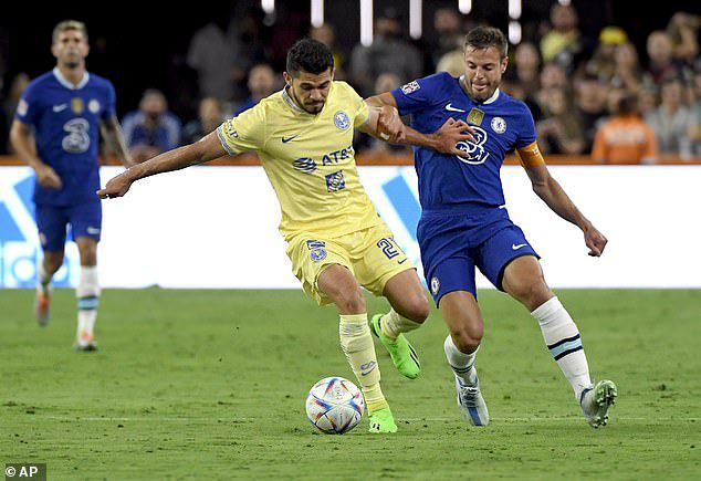 Chelsea's Cesar Azpilicueta challenges Club America striker Henry Martin for the ball