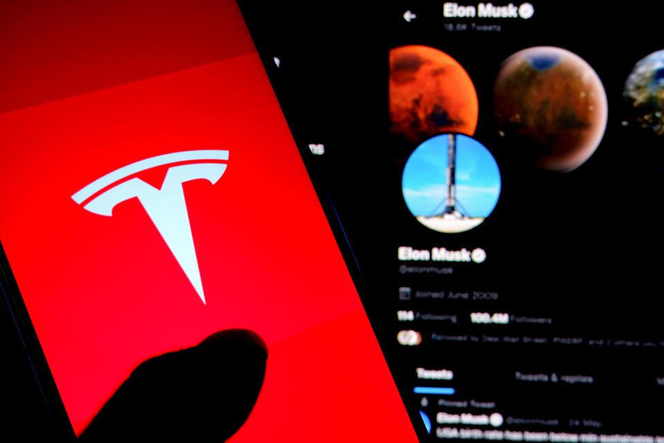 India - 07/07/2022: In this photo illustration, the Tesla logo is displayed on a smartphone screen with Elon Musk's Twitter page in the background.  (Image illustration by Avishek Das/SOPA Images/LightRocket via Getty Images)
