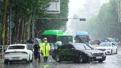 Cars in heavy rain block a road in Seoul, South Korea on August 9.