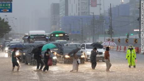 Record rain killed at least 9 people in Seoul as water inundated buildings and inundated cars