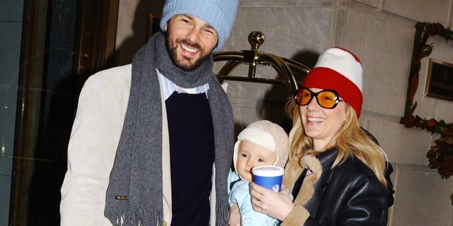 Actress Anne Heche, husband Coley Laffoon and baby Homer wait for a car at 59th Street and 5th Avenue on December 13, 2002 in New York City.  