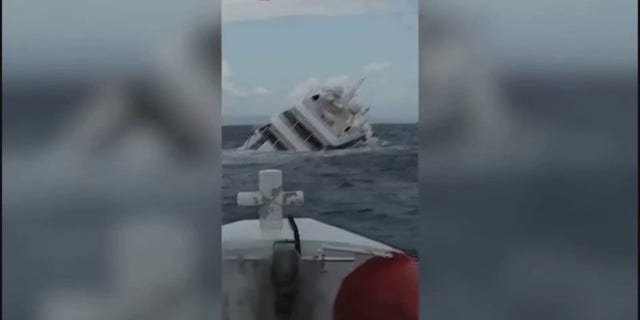 The yacht is heavily lined to the right before submerging under the water.