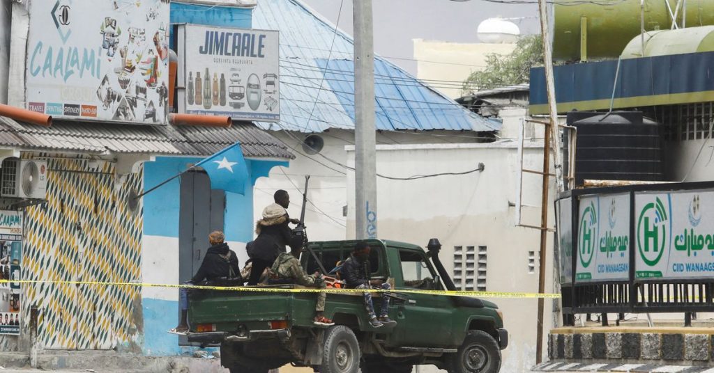 At least 12 killed as hotel siege enters Somalia on second day