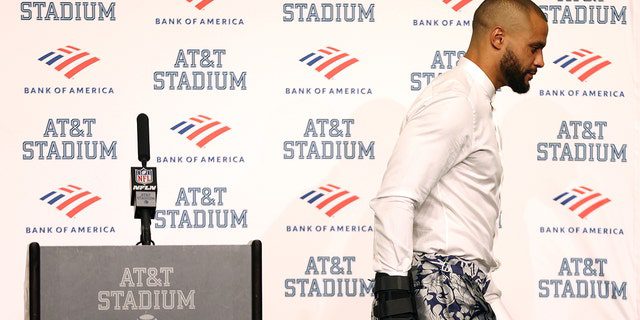 Quarterback Dak Prescott, #4 of the Dallas Cowboys, walks off the podium during the post-game press conference after a 19-3 loss to the Tampa Bay Buccaneers at AT&D's Arena.  T on September 11, 2022 in Arlington, Texas.  Prescott left the game with a hand injury in the fourth quarter.