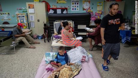 Evacuees take refuge in the classroom at a public school in Guayanila, Puerto Rico.