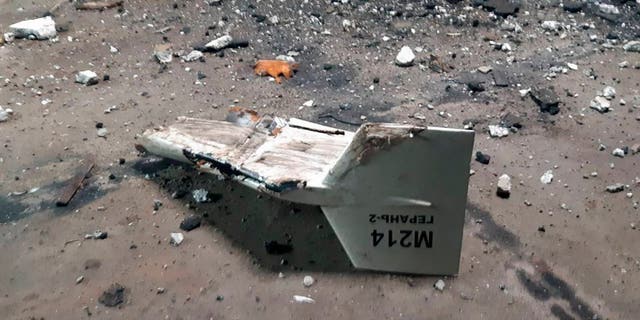 This undated photo released by the Ukrainian Army's Strategic Communications Department shows the wreckage of what Kyiv described as an Iranian Shahed UAV that was shot down near Kobyansk, Ukraine. 
