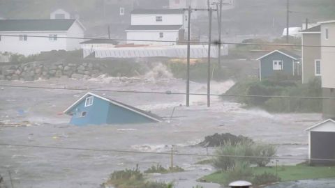 Water surrounds a collapsed house in Channel Port, au Basque Country, Newfoundland, on Saturday. 