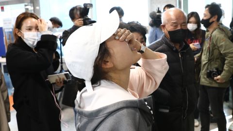 Relatives of missing persons cry at a community service center on October 30 in Seoul, South Korea. 
