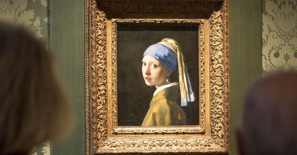 Climate demonstrator sticks his head on the painting "The Girl with the Pearl Earring"