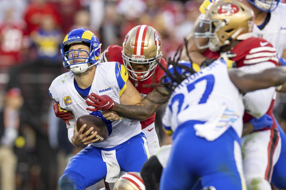 49ers coernerback Deodore Lenoir sacks quarterback Matthew Stafford during San Francisco's win.  (Photo from Associated Press/Jeff Lewis)
