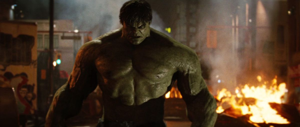 The Hulk, looking very angry, on a burning street in The Incredible Hulk (2008).