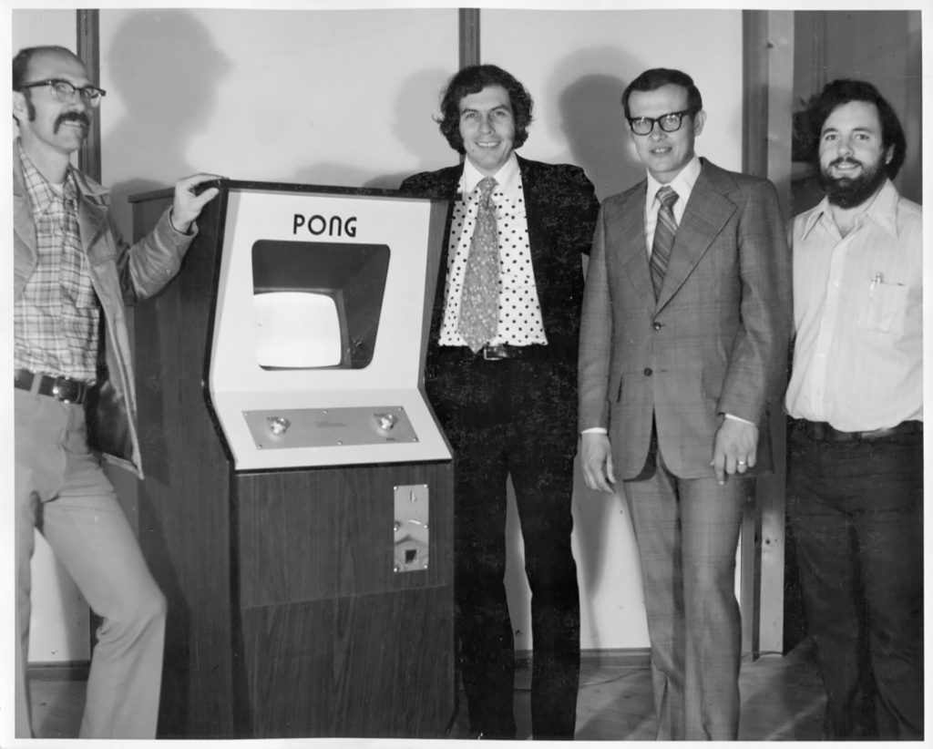 Alcorn (far right) with Atari founders Ted Dabney (left) and Nolan Bushnell and employee Fred Marinsek, with an early pong console.