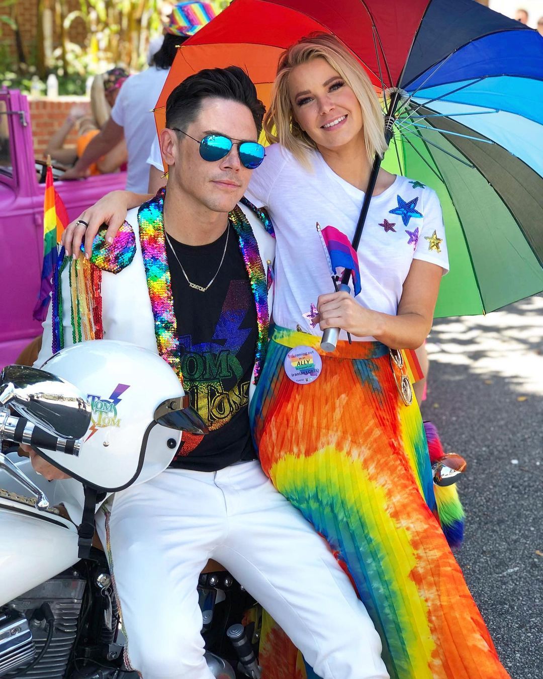 Ariana Madix sits on Tom Sandoval's lap for a photo.