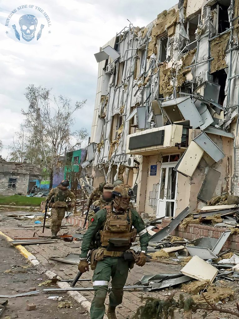 PMC Wagner mercenaries stand in Popasna, Sievierodonetsk district in Luhansk Oblast, eastern Ukraine