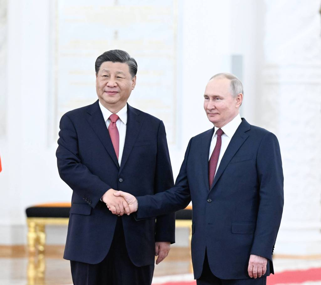 Chinese President Xi Jinping shakes hands with Russian President Vladimir Putin at the Kremlin in Moscow, Russia.
