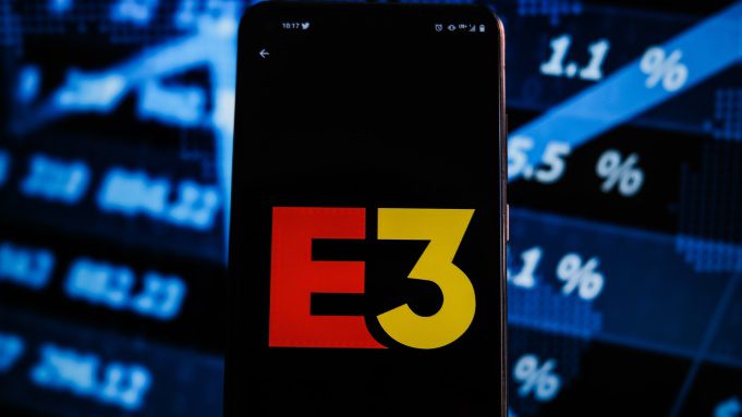 POLAND - 06/15/2021: In this illustration, the E3 logo is shown on a smartphone with stock market proportions on the background.  (Photo illustration by Omar Marquez/SOPA Images/LightRocket via Getty Images)