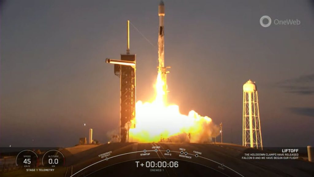 A SpaceX Falcon 9 rocket carrying 40 OneWeb internet satellites lifts off from NASA