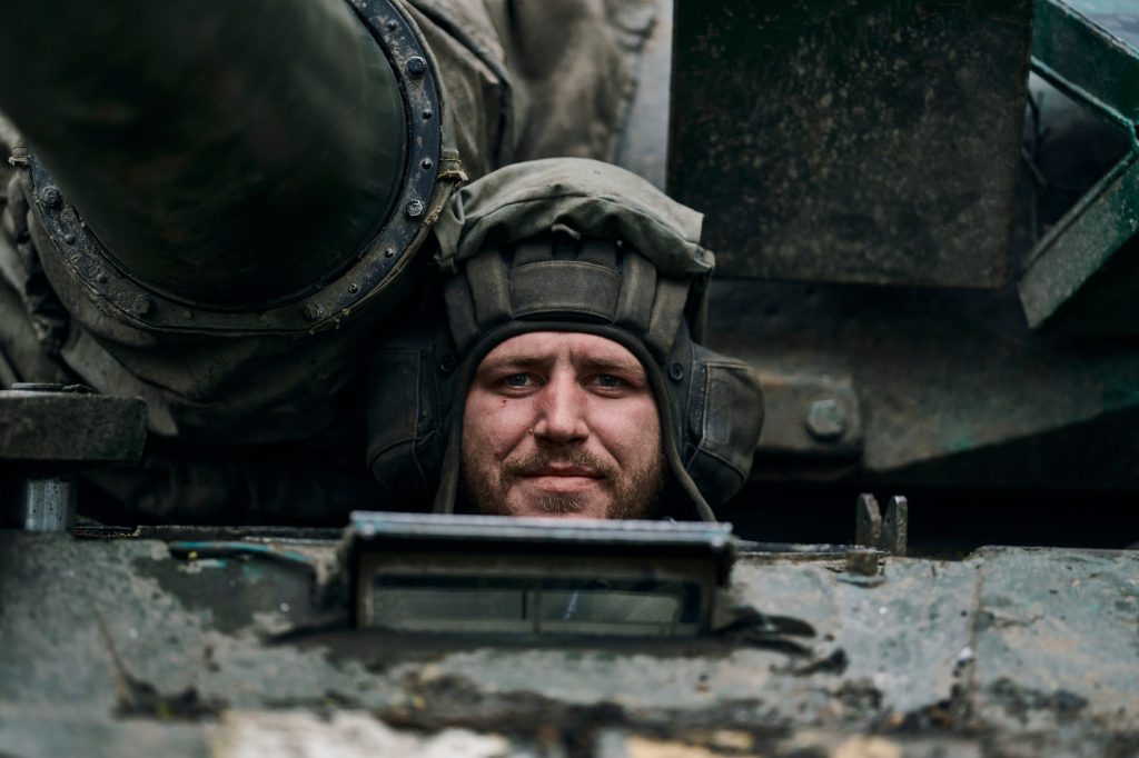 A Ukrainian soldier looks out from a tank on the front line in Pakhmut, Donetsk region, Ukraine, Sunday, April 23, 2023.