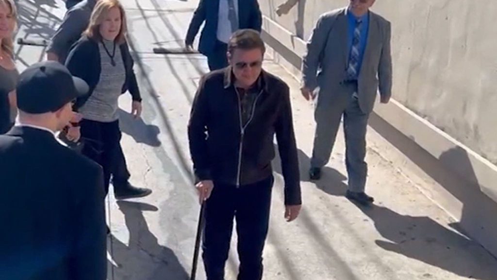Jeremy Renner walks around Kimmel with a cane after a snowplow accident