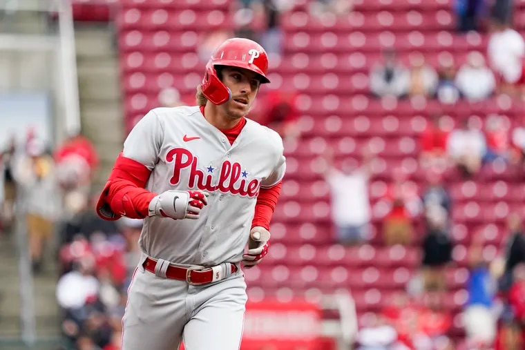 The Phillies coped with a rain delay and finally earned compensation in a 14-3 win over the Reds